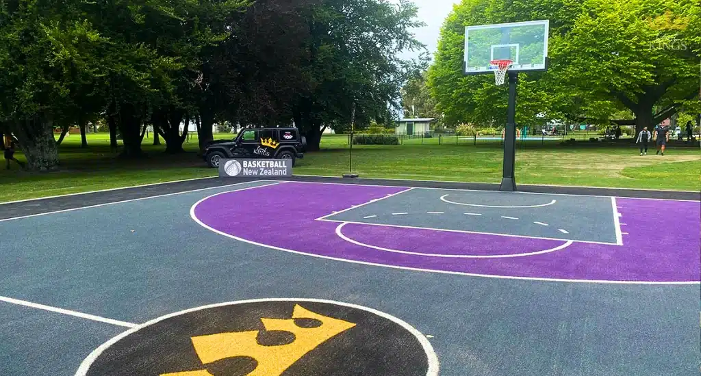 Court Kings and Basketball NZ co-branded purple outdoor court.